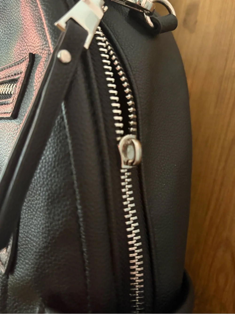 Madden NYC Black Mini Backpack with Front Zip Pockets
